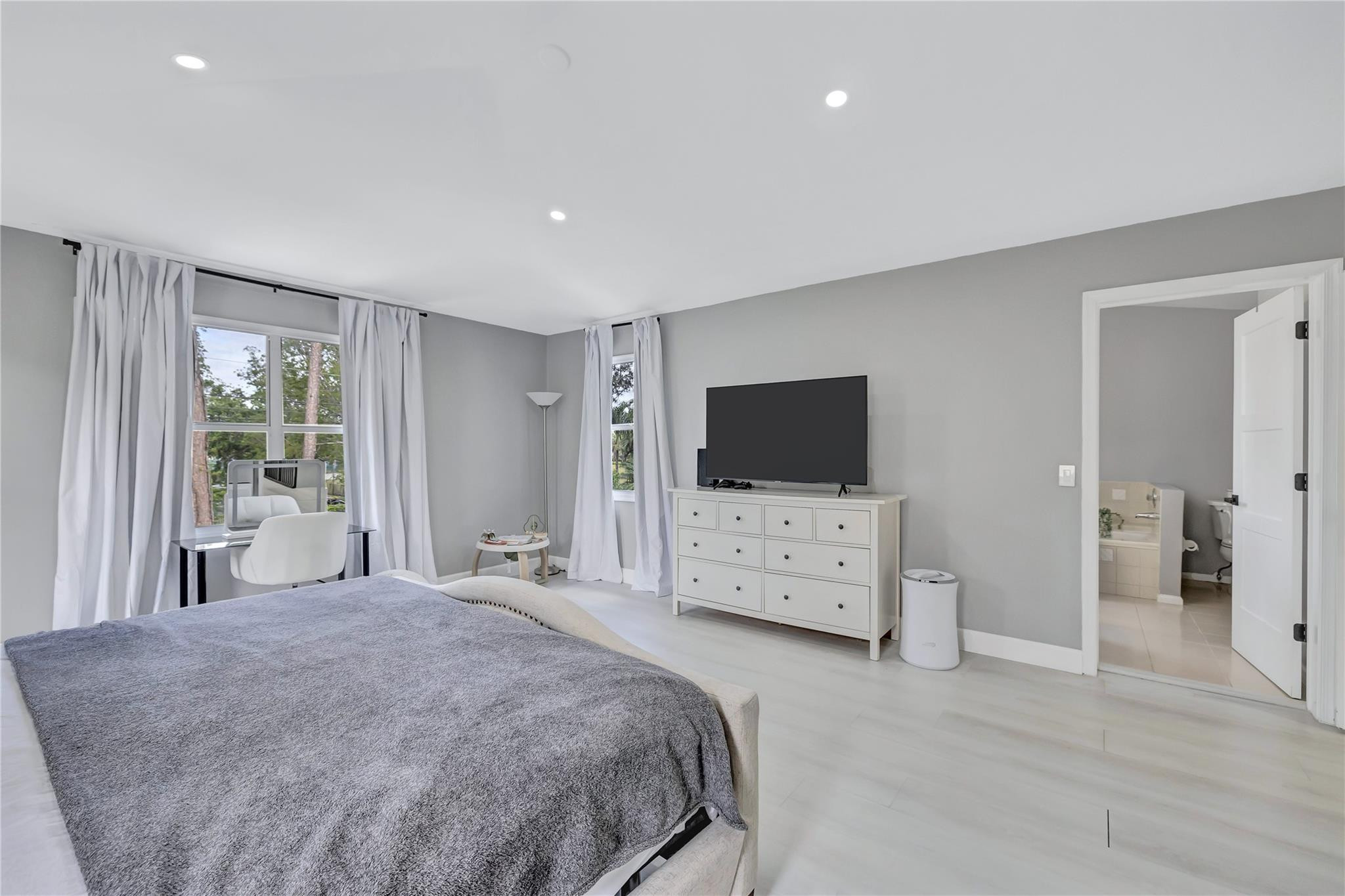 8613 Windy Circle Boynton Beach, FL 33472 - Photo 18 of 51 a bedroom with furniture and flat screen tv