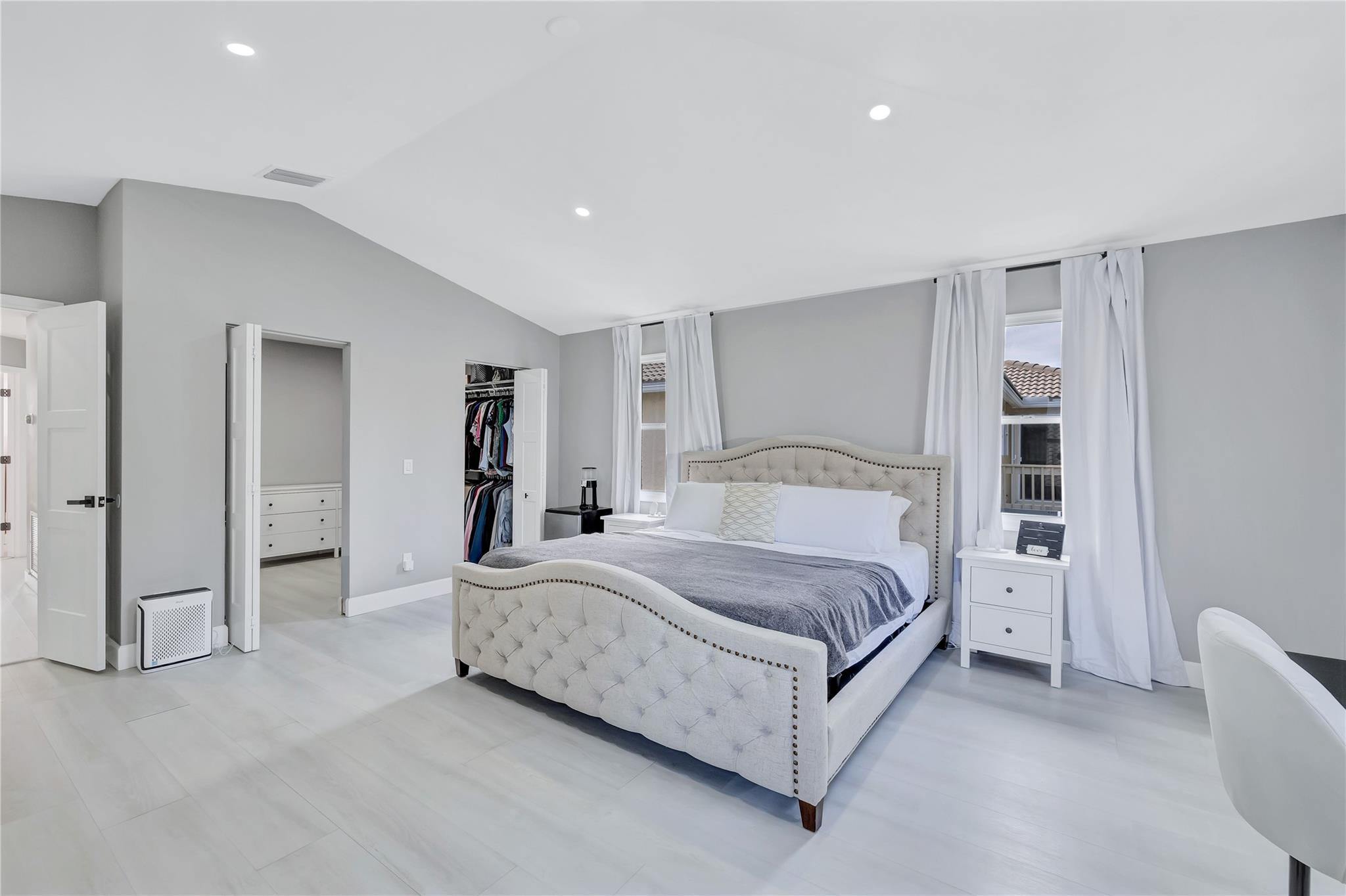 8613 Windy Circle Boynton Beach, FL 33472 - Photo 25 of 51 a spacious bedroom with a bed and a couch