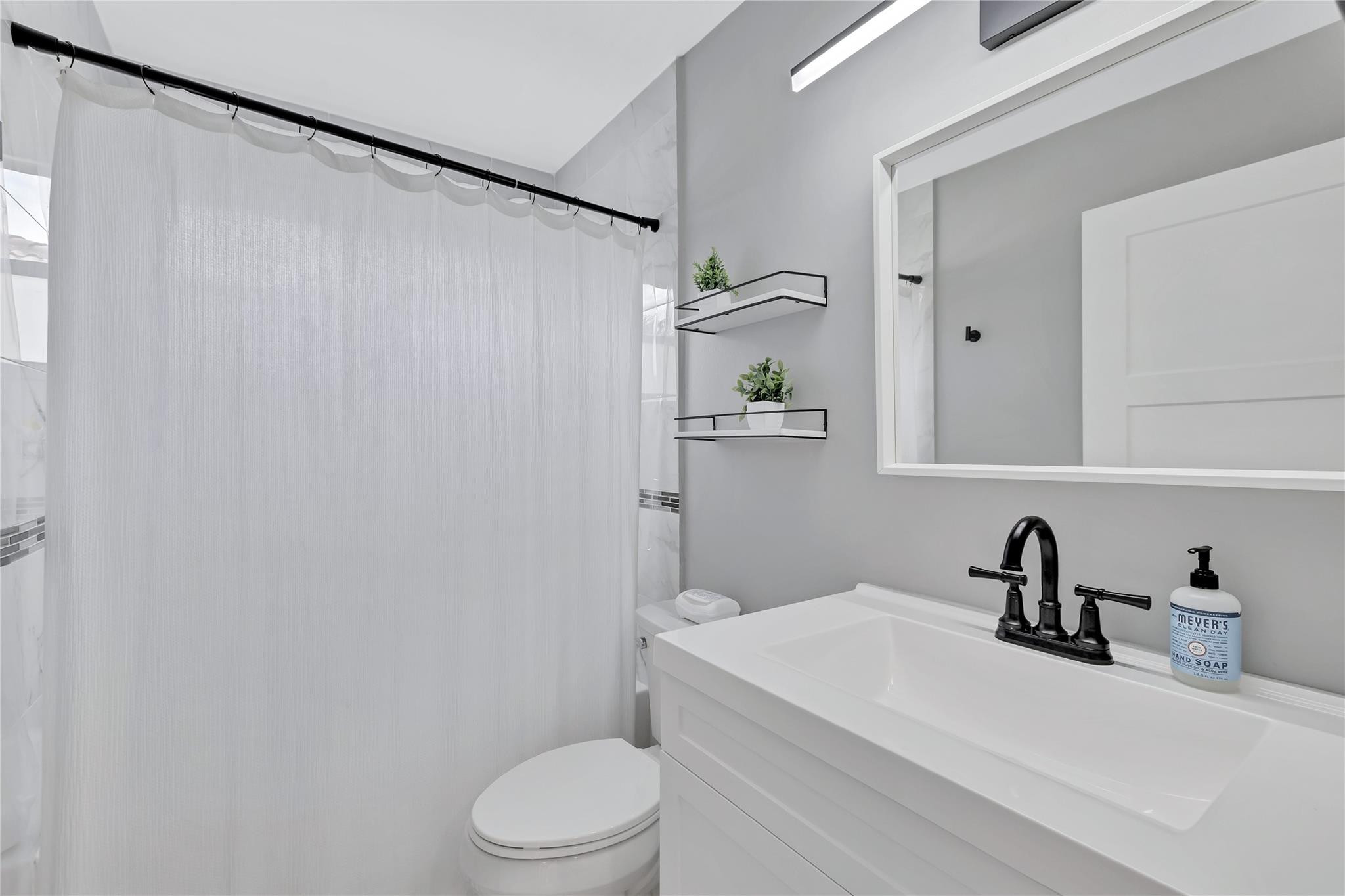 8613 Windy Circle Boynton Beach, FL 33472 - Photo 29 of 51 a white toilet sitting next to a bathroom sink