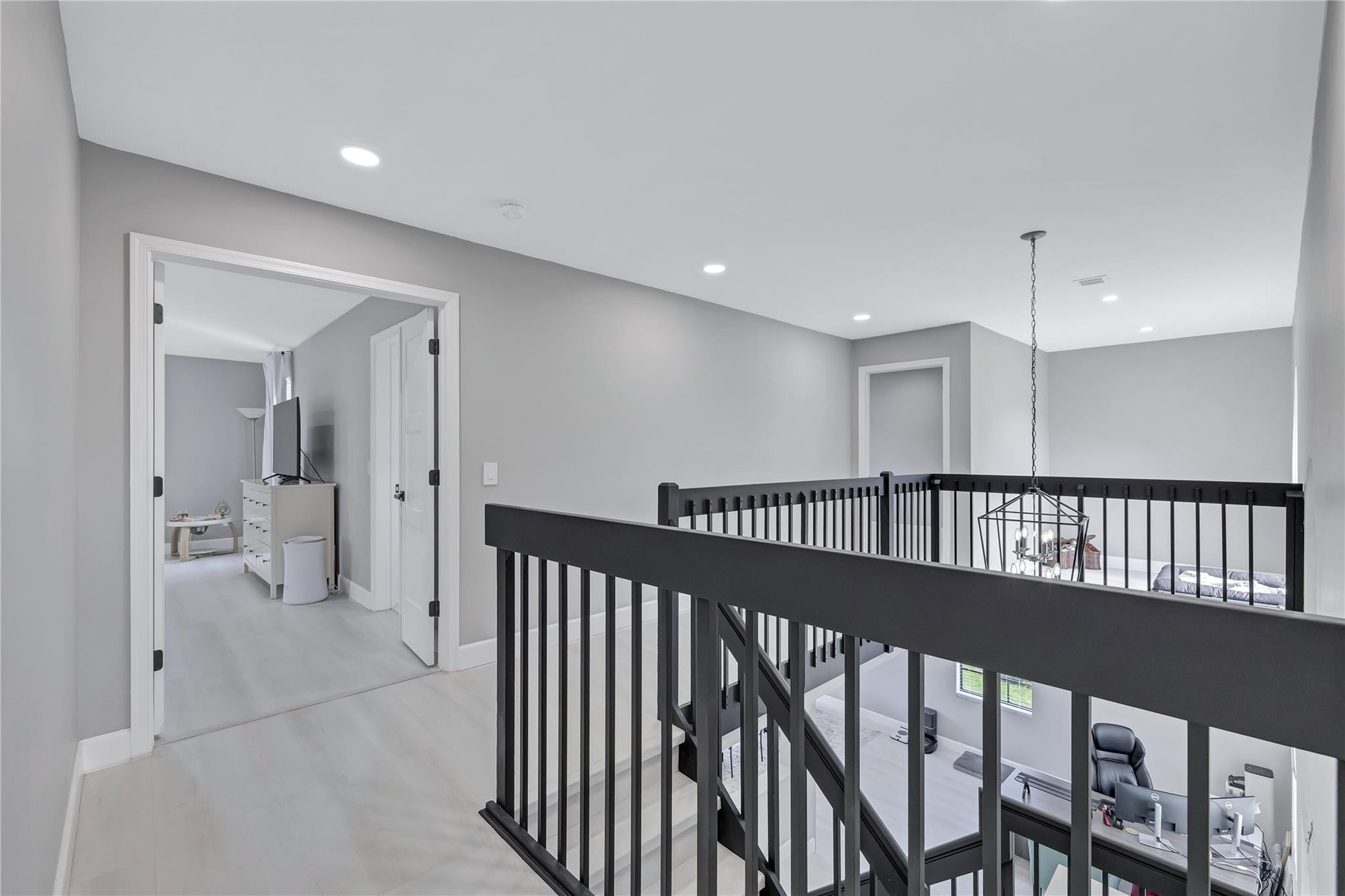 8613 Windy Circle Boynton Beach, FL 33472 - Photo 36 of 51 a view of a hallway with wooden floor and a bathroom