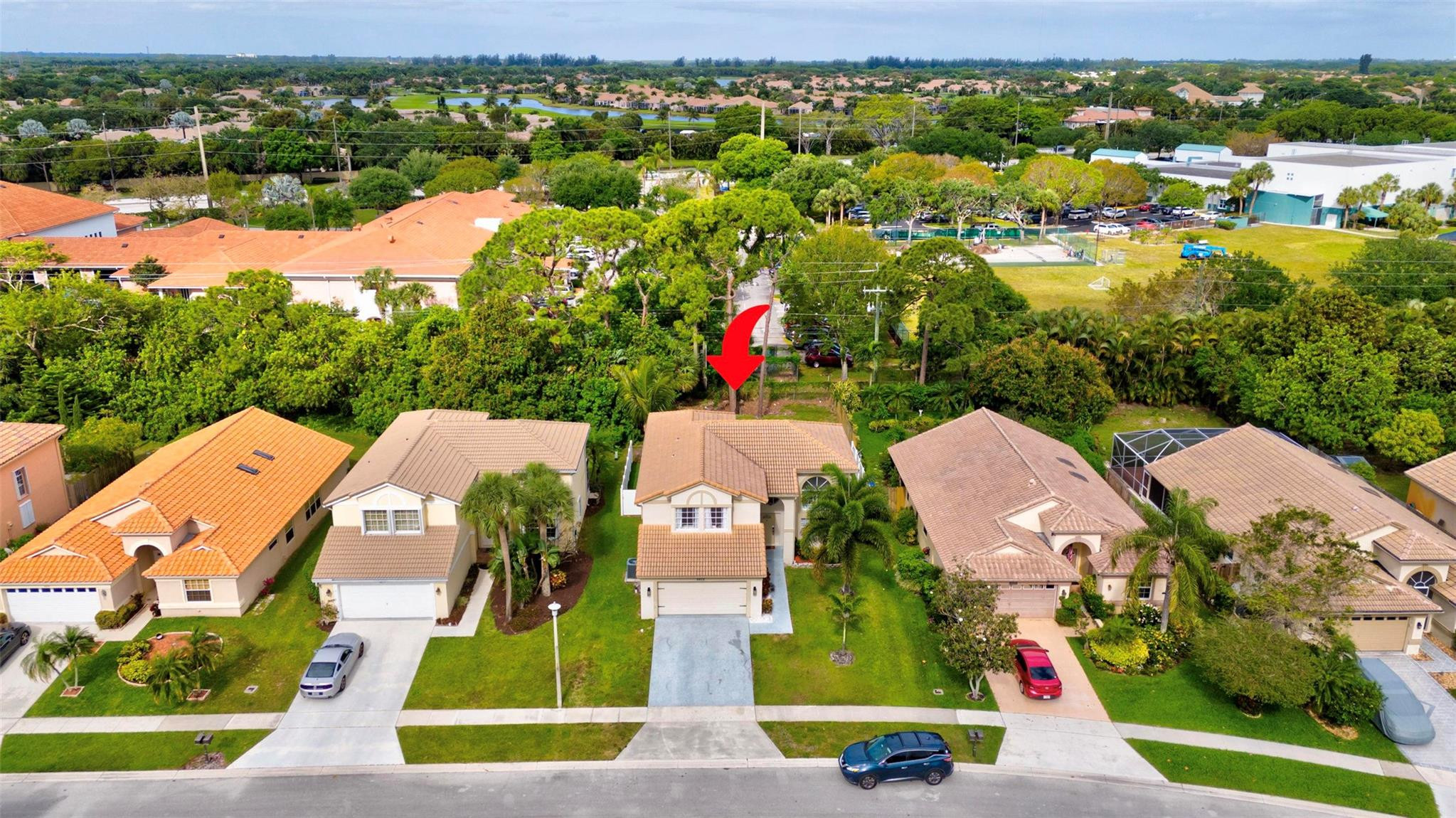 8613 Windy Circle Boynton Beach, FL 33472 - Photo 41 of 51 an aerial view of residential houses with outdoor space and parking