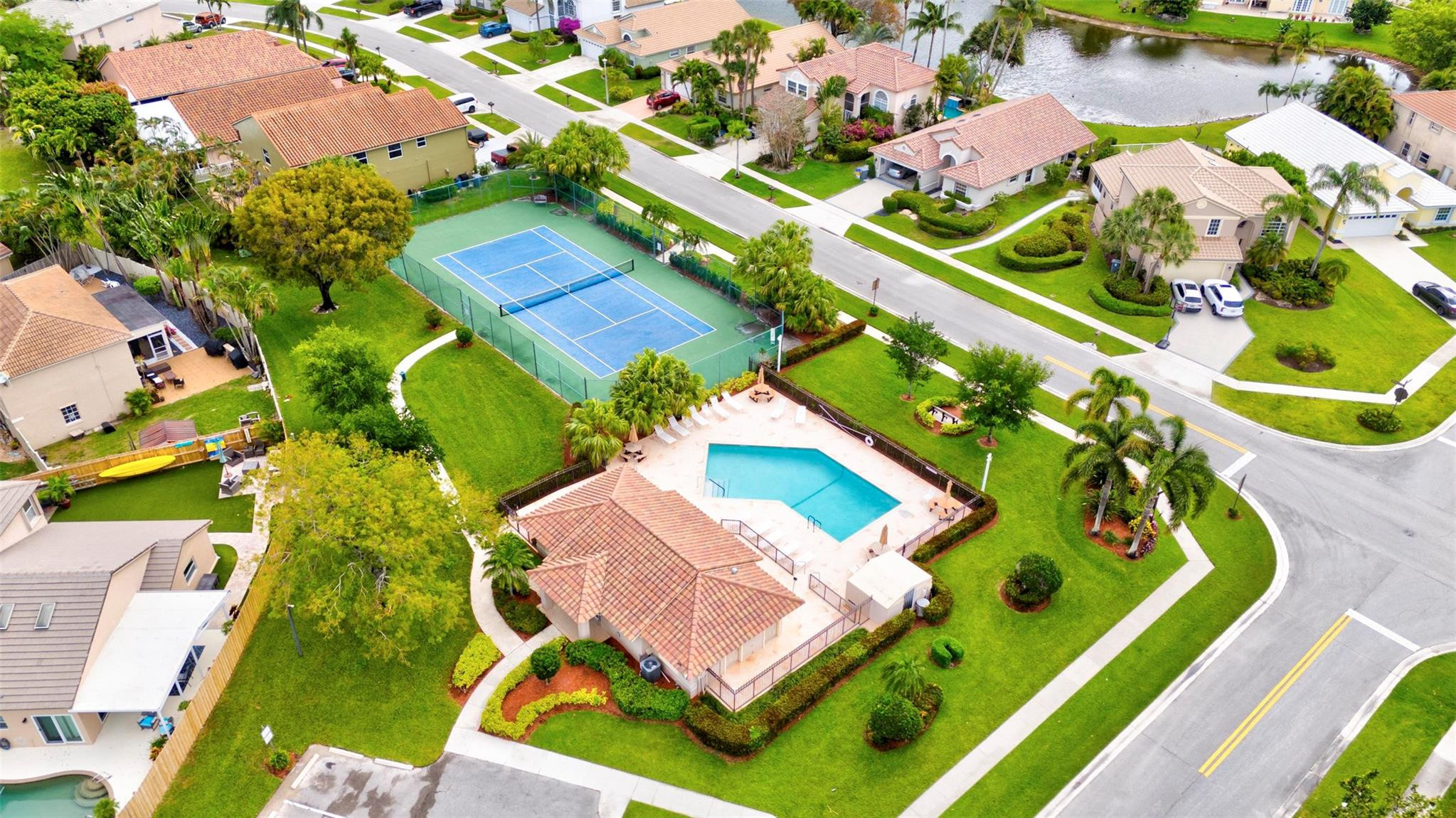 8613 Windy Circle Boynton Beach, FL 33472 - Photo 45 of 51 an aerial view of a pool yard patio and outdoor seating
