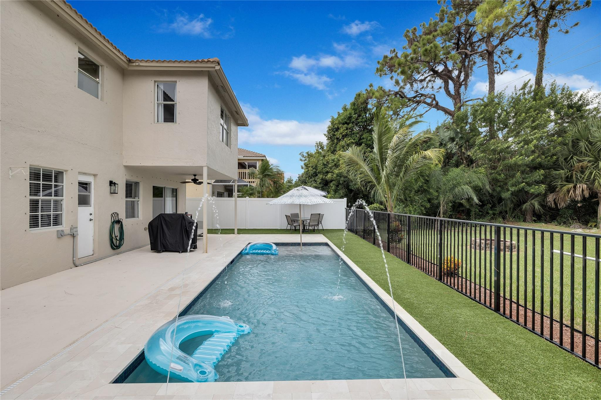 8613 Windy Circle Boynton Beach, FL 33472 - Photo 48 of 51 a view of a house with backyard and sitting area