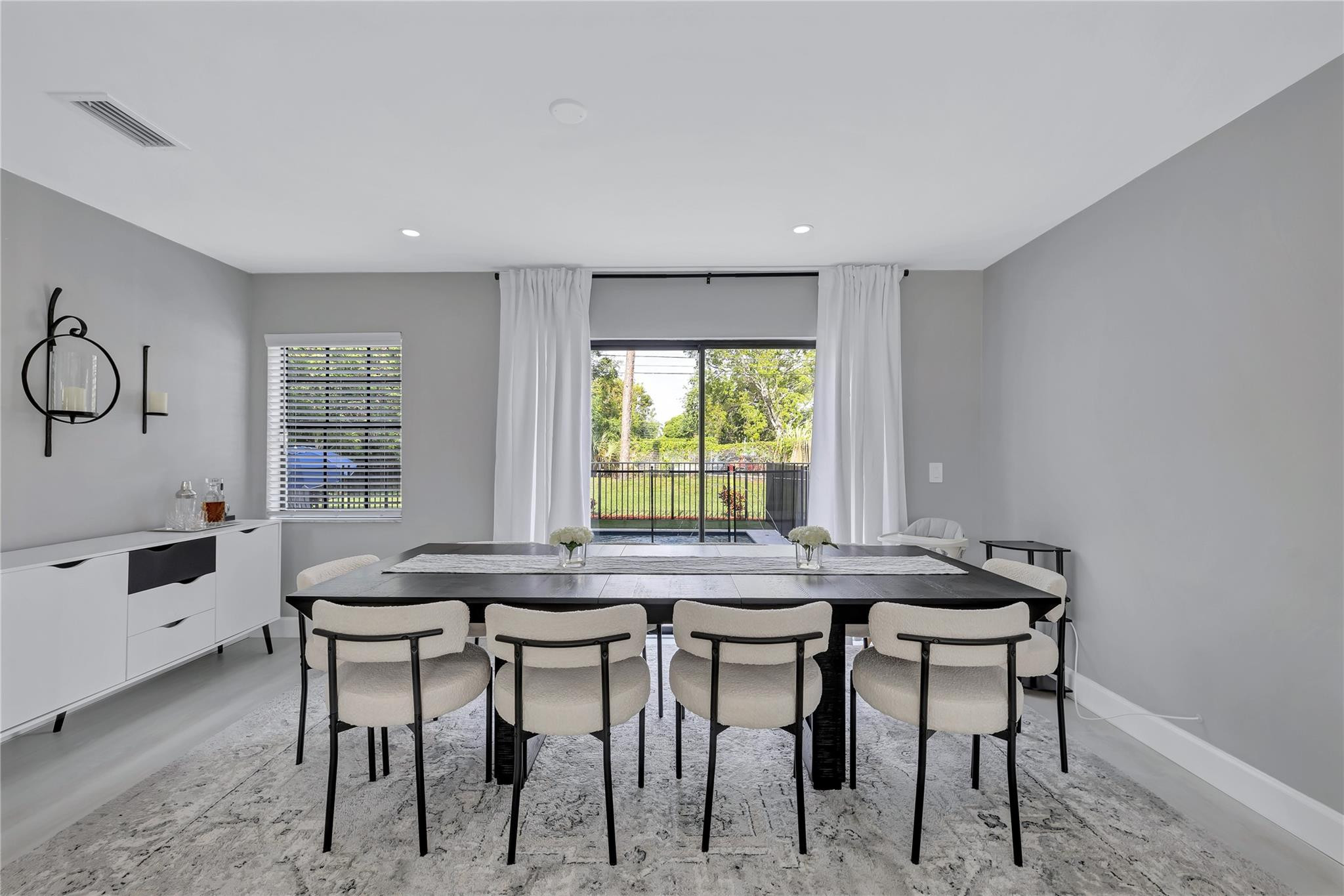 8613 Windy Circle Boynton Beach, FL 33472 - Photo 9 of 51 a dining room with furniture and window