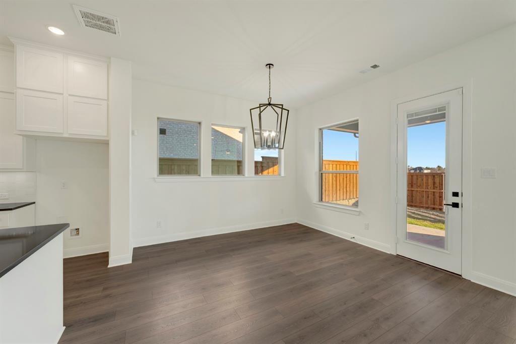 1941 Foothill Road Rockwall, TX 75087 - Photo 24 of 37 a view of an empty room with window and wooden floor
