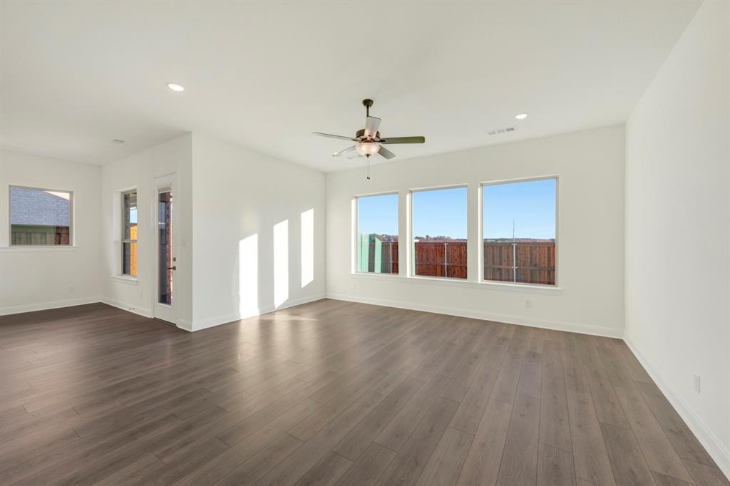 1941 Foothill Road Rockwall, TX 75087 - Photo 27 of 37 a view of an empty room with a window and wooden floor