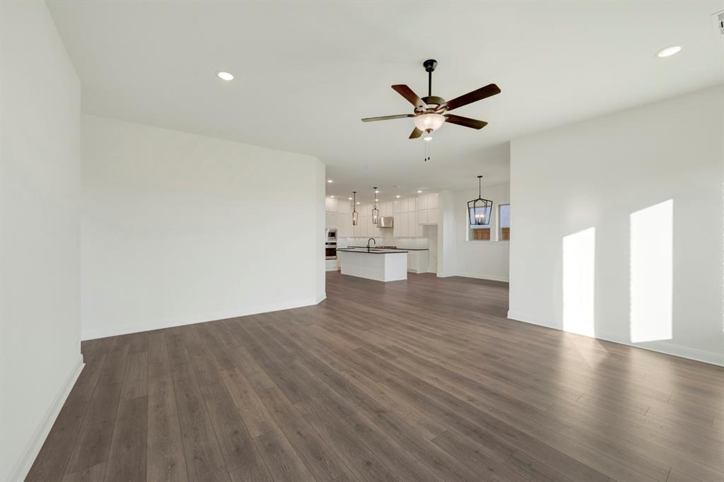 1941 Foothill Road Rockwall, TX 75087 - Photo 28 of 37 a view of empty room with wooden floor and ceiling fan