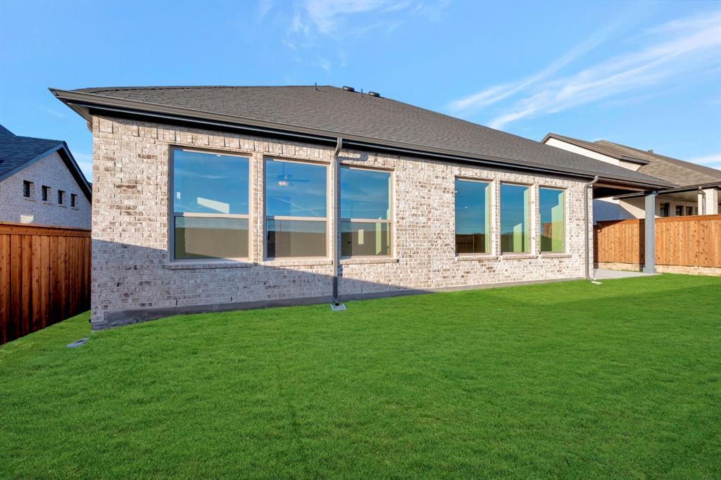 1941 Foothill Road Rockwall, TX 75087 - Photo 3 of 37 a front view of a house with a yard