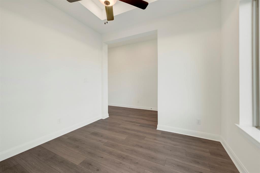 1941 Foothill Road Rockwall, TX 75087 - Photo 9 of 37 an empty room with wooden floor ceiling fan and window
