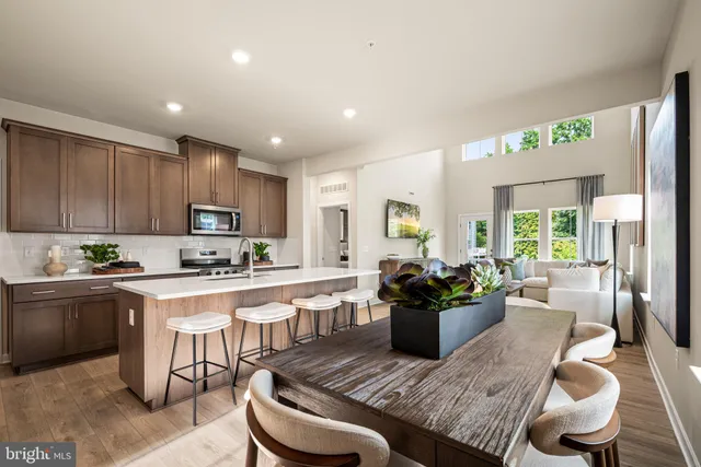 a kitchen with a table and chairs