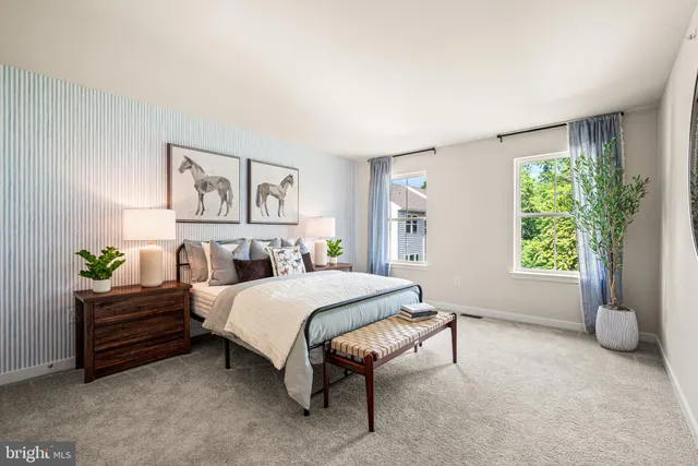 a spacious bedroom with a bed and a window