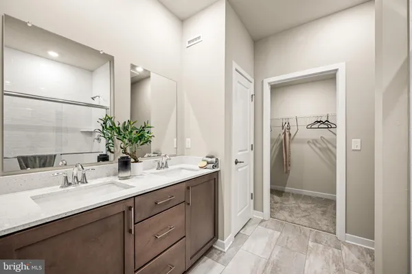 a bathroom with a sink and mirror