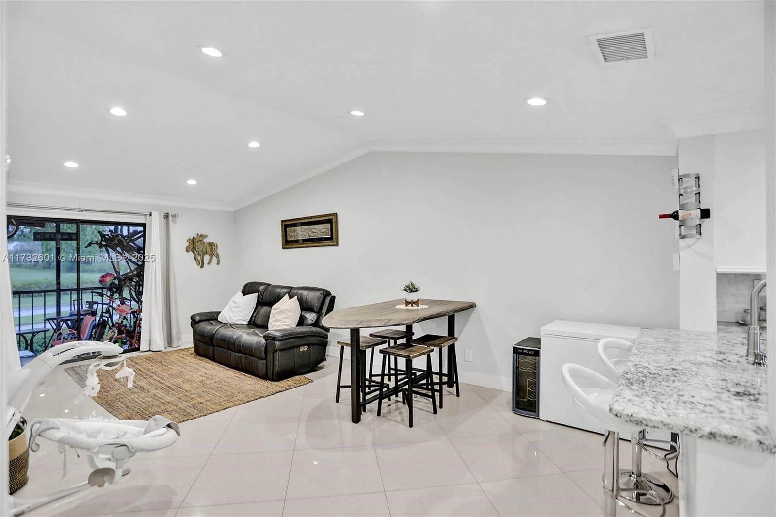 9395 Boca Cove Circle, Unit 1208 Boca Raton, FL 33428 - Photo 11 of 33 a living room with furniture