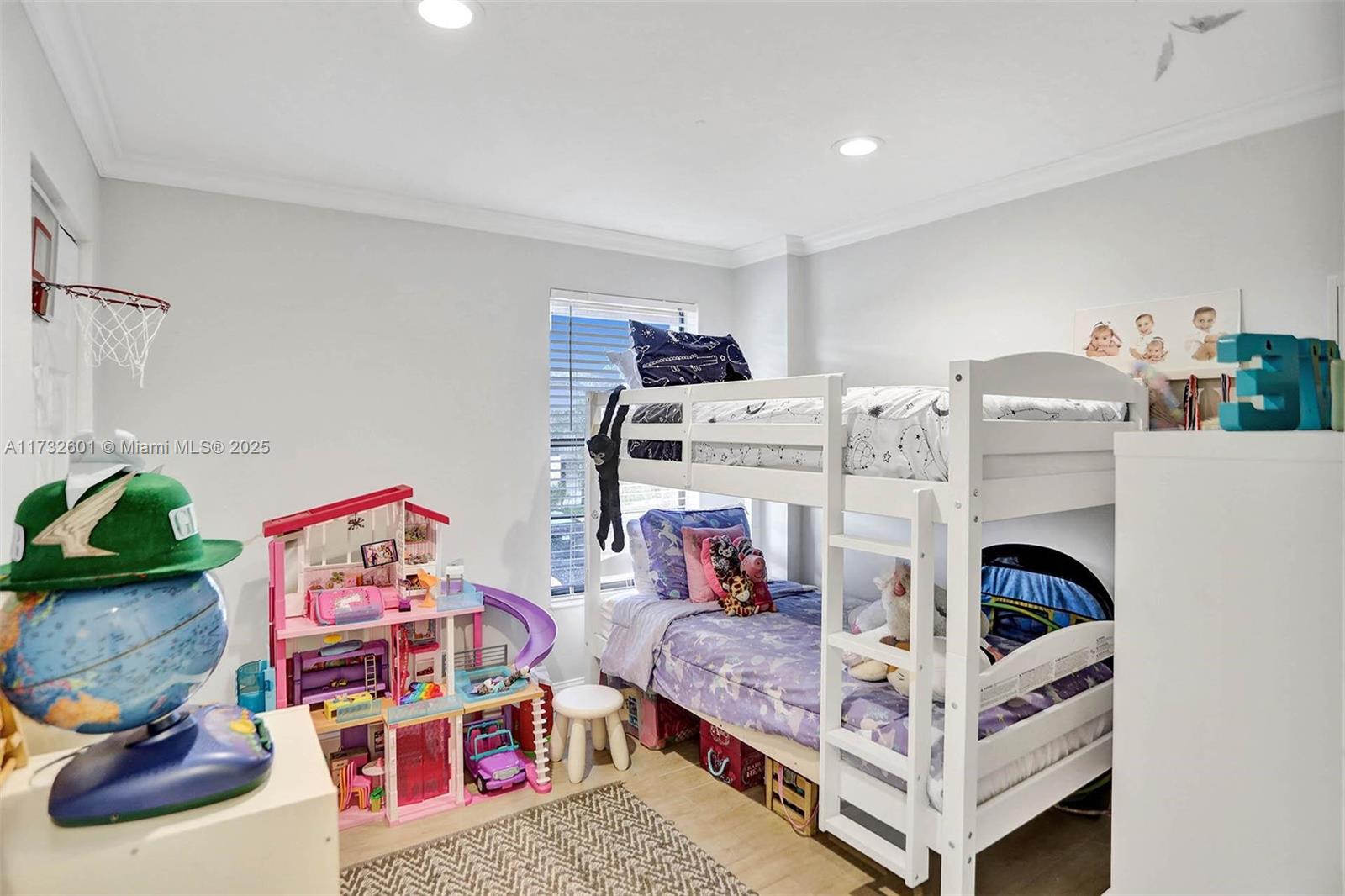 9395 Boca Cove Circle, Unit 1208 Boca Raton, FL 33428 - Photo 13 of 33 a view of a bedroom with baby toys