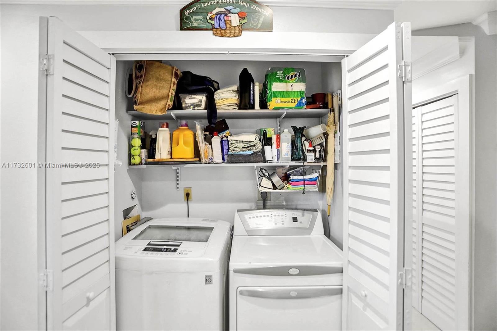9395 Boca Cove Circle, Unit 1208 Boca Raton, FL 33428 - Photo 23 of 33 a utility room with dryer and washer