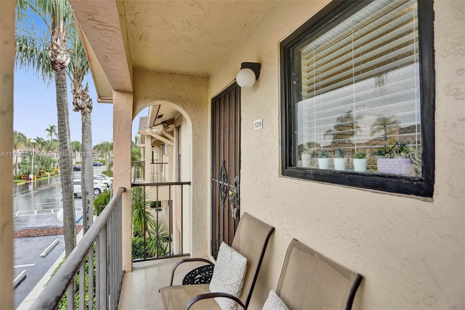 9395 Boca Cove Circle, Unit 1208 Boca Raton, FL 33428 - Photo 26 of 33 a view of a balcony with furniture