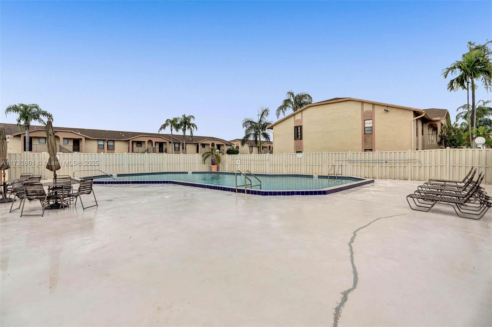 9395 Boca Cove Circle, Unit 1208 Boca Raton, FL 33428 - Photo 32 of 33 a view of swimming pool with outdoor seating