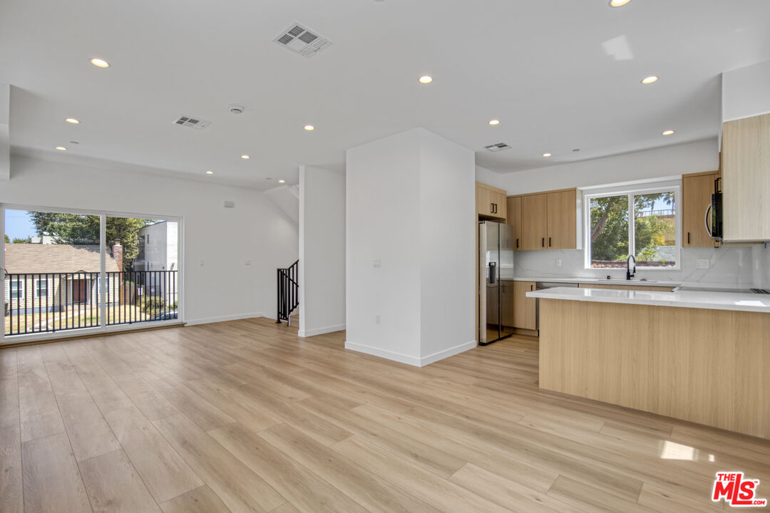 10828 Hesby Street North Hollywood, CA 91601 - Photo 12 of 33 a view of kitchen with stainless steel appliances refrigerator oven and cabinets