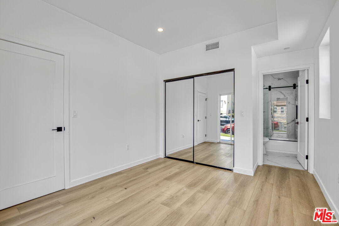10828 Hesby Street North Hollywood, CA 91601 - Photo 15 of 33 a view of empty room with wooden floor