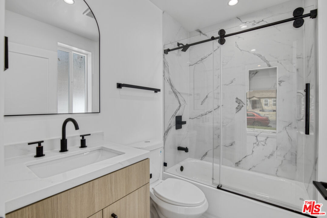 10828 Hesby Street North Hollywood, CA 91601 - Photo 16 of 33 a bathroom with a sink toilet and shower