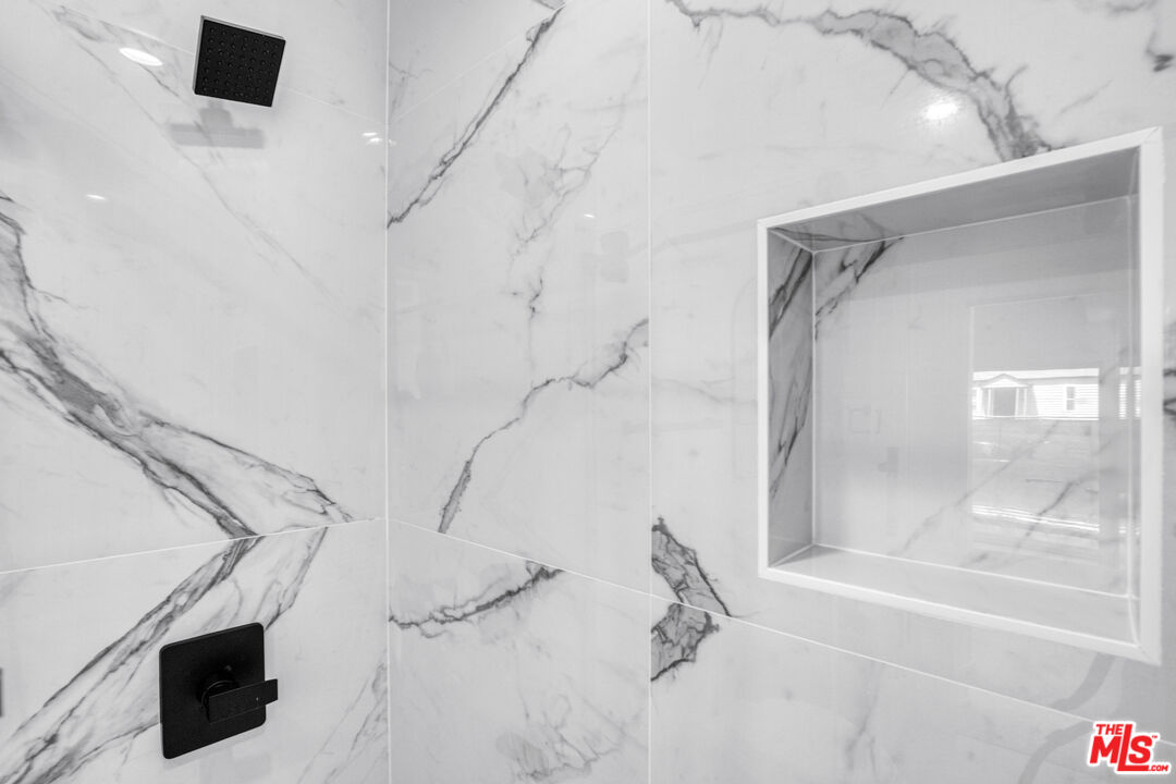 10828 Hesby Street North Hollywood, CA 91601 - Photo 22 of 33 a bathroom with a bathtub and a shower