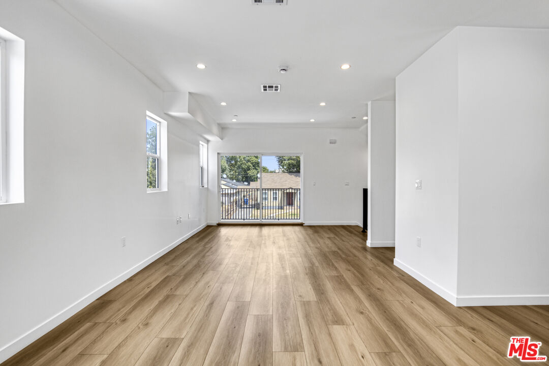 10828 Hesby Street North Hollywood, CA 91601 - Photo 24 of 33 a view of an empty room with wooden floor