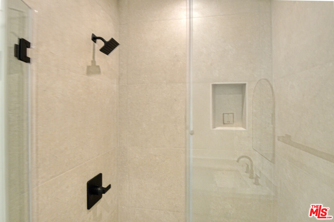 10828 Hesby Street North Hollywood, CA 91601 - Photo 25 of 33 a bathroom with a shower