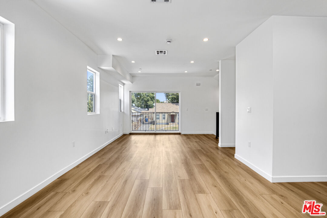 10828 Hesby Street North Hollywood, CA 91601 - Photo 28 of 33 a view of an empty room with wooden floor