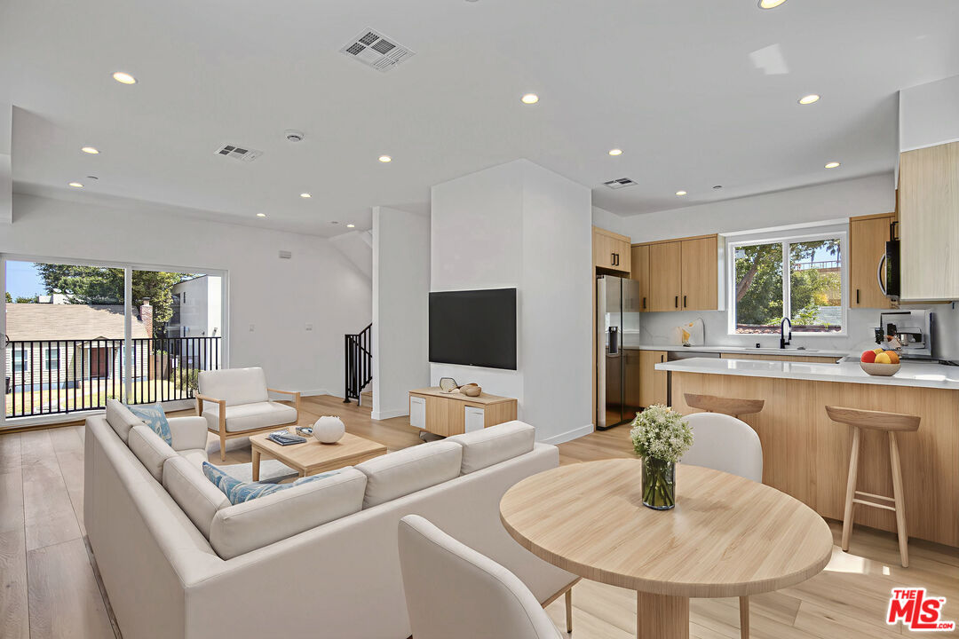 10828 Hesby Street North Hollywood, CA 91601 - Photo 9 of 33 a living room with furniture and a table