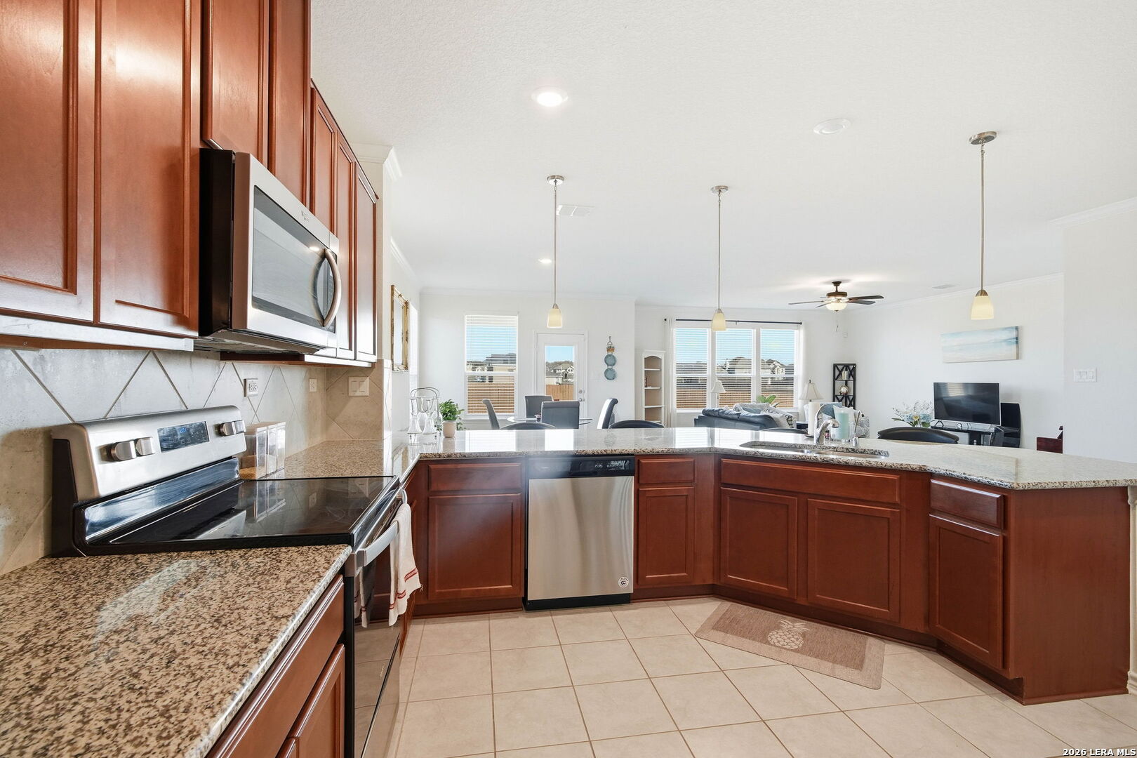 5103 Devanado Way San Antonio, TX 78261 - Photo 20 of 42 a kitchen with a sink a stove and cabinets