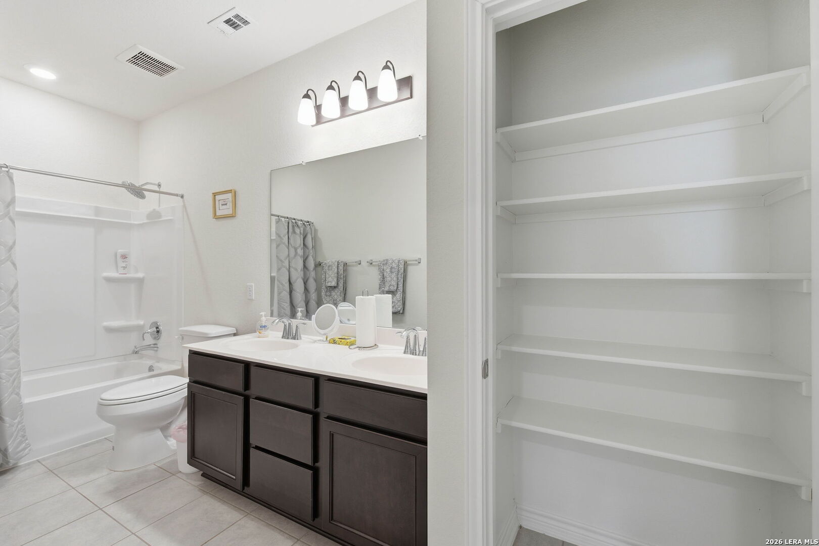5103 Devanado Way San Antonio, TX 78261 - Photo 32 of 42 a bathroom with a sink a toilet and shower