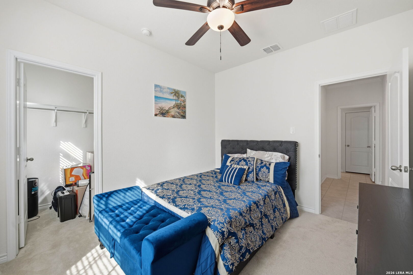 5103 Devanado Way San Antonio, TX 78261 - Photo 35 of 42 a bedroom with a bed and a chandelier