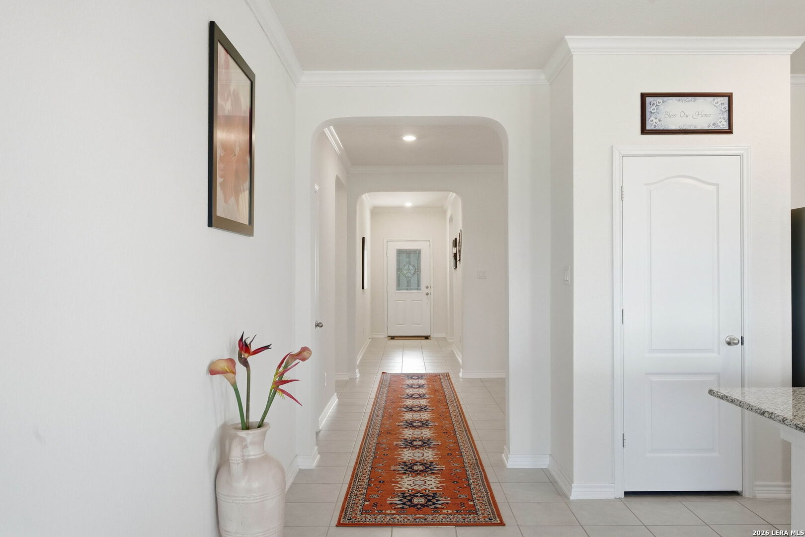 5103 Devanado Way San Antonio, TX 78261 - Photo 5 of 42 a view of a hallway with wooden floor and a bathroom
