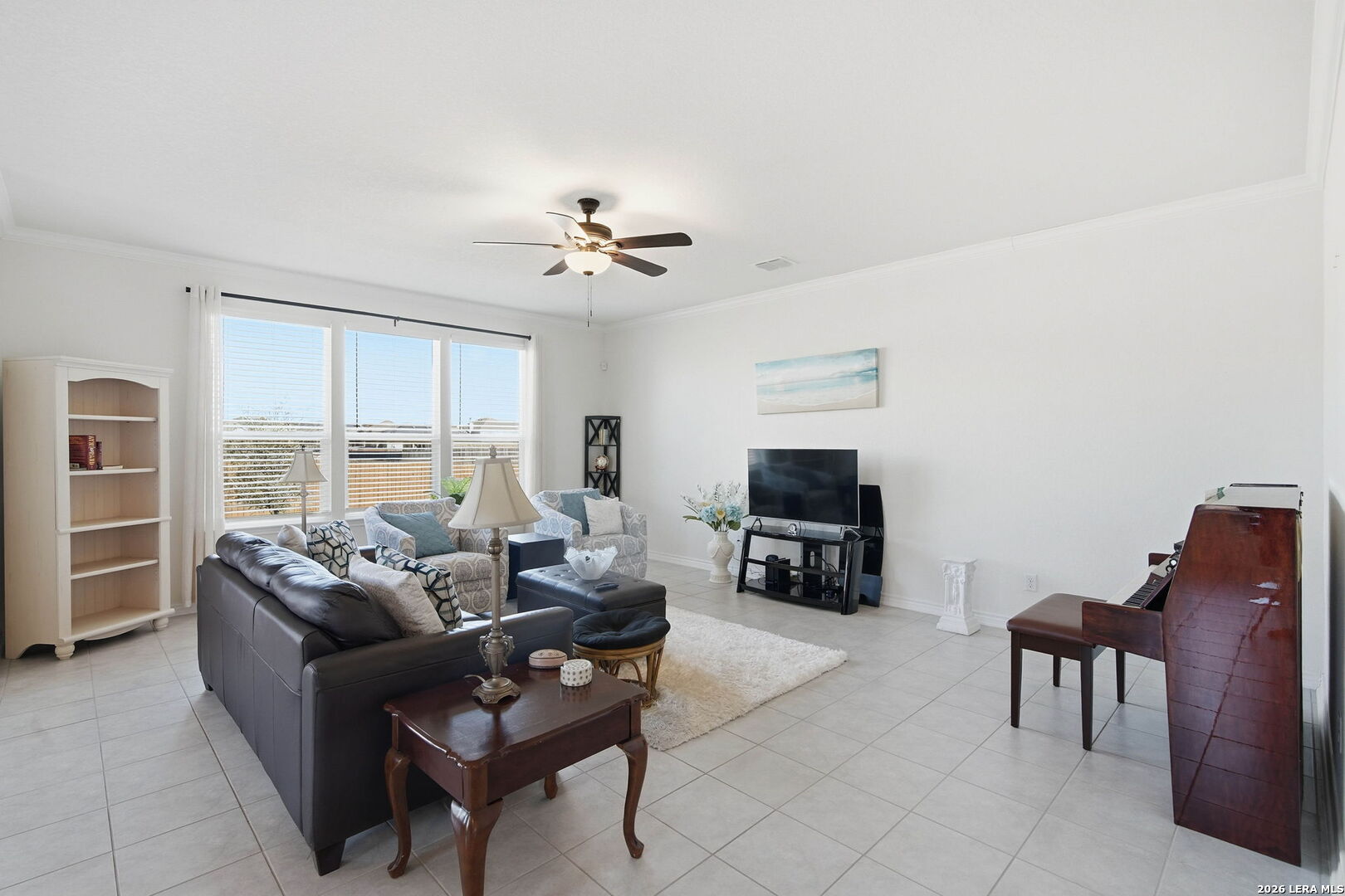 5103 Devanado Way San Antonio, TX 78261 - Photo 10 of 42 a living room with furniture a flat screen tv and a large window