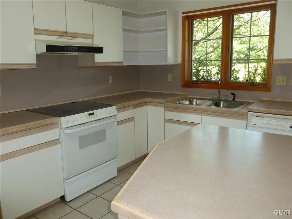 111 James Way Road Bath, PA 18014 - Photo 7 of 31 a kitchen with a sink cabinets and window