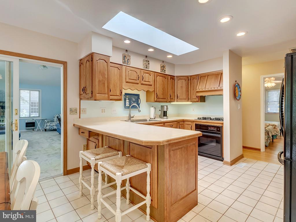 32 Harpoon Road Ocean Pines, MD 21811 - Photo 21 of 37 a kitchen with a sink a counter top space and appliances
