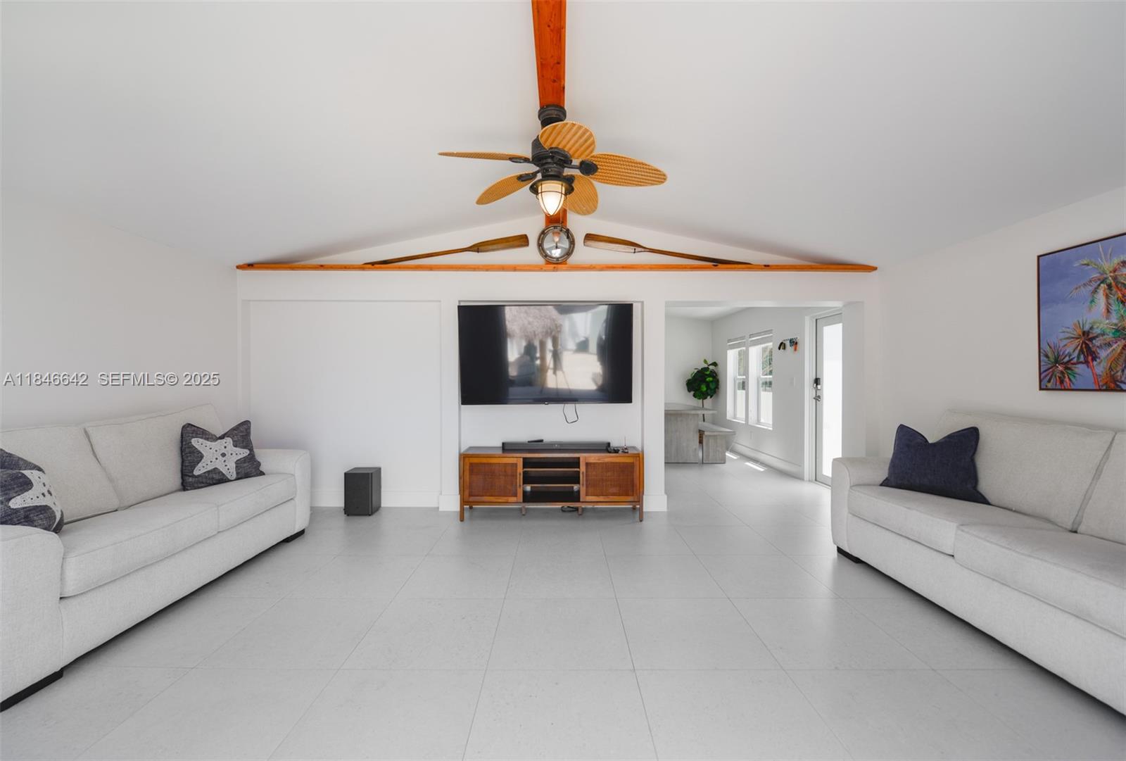 11 Mockingbird Road Key Largo, FL 33037 - Photo 14 of 44 a living room with furniture and a chandelier