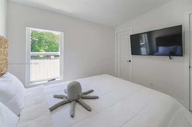 a bathroom with a shower and a toilet sink