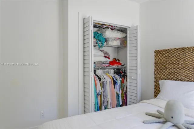 a room with a bed and a window