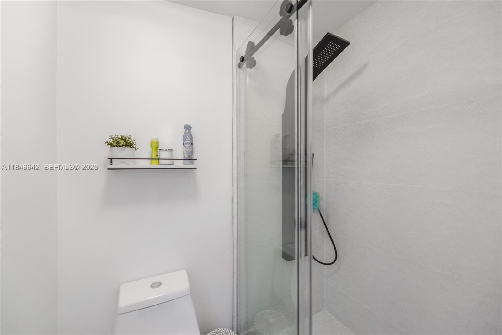 11 Mockingbird Road Key Largo, FL 33037 - Photo 20 of 44 a bathroom with a shower and a toilet sink