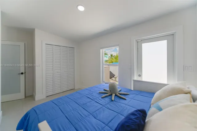 a bathroom with a sink toilet and a mirror