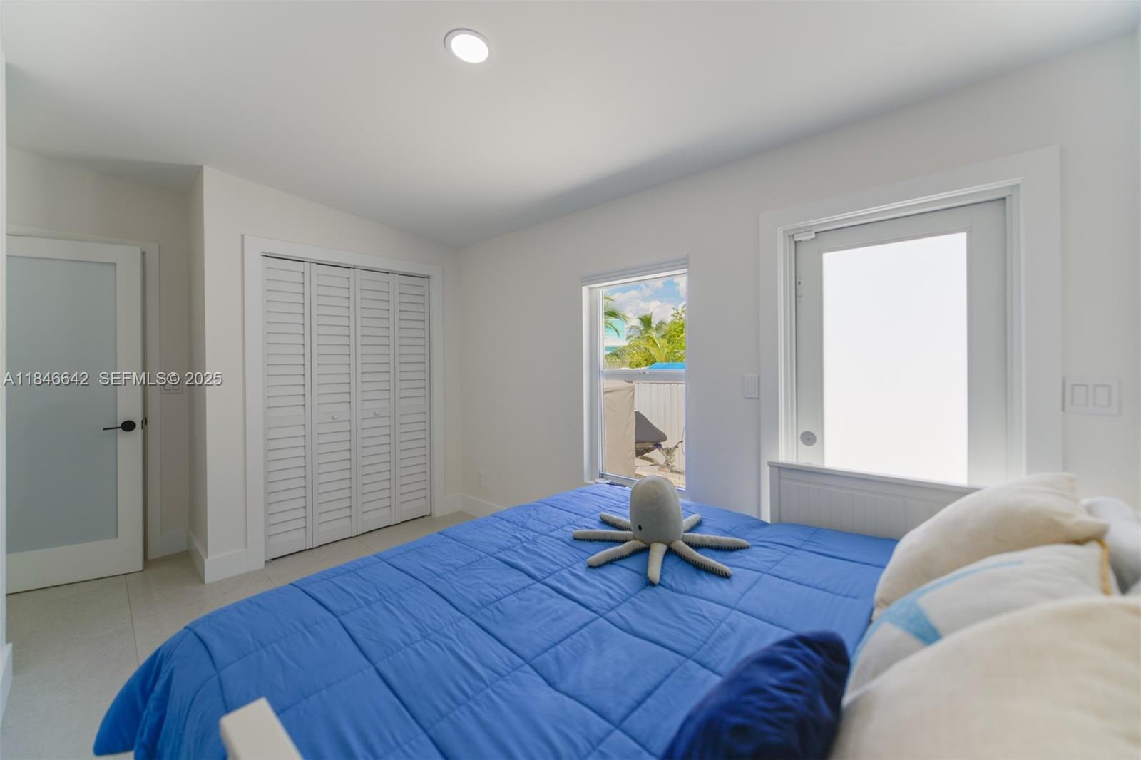 11 Mockingbird Road Key Largo, FL 33037 - Photo 22 of 44 a living room with furniture and a wooden floor