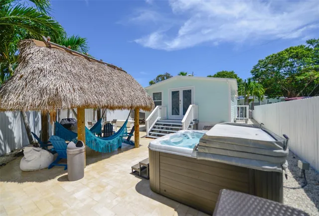 a view of an entryway with wooden floor and a potted plant