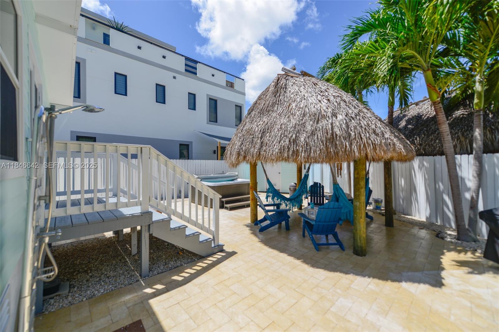 11 Mockingbird Road Key Largo, FL 33037 - Photo 35 of 44 swimming pool view with a outdoor seating