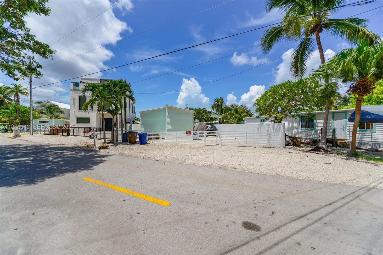 11 Mockingbird Road Key Largo, FL 33037 - Photo 44 of 44 front view of a house with a street