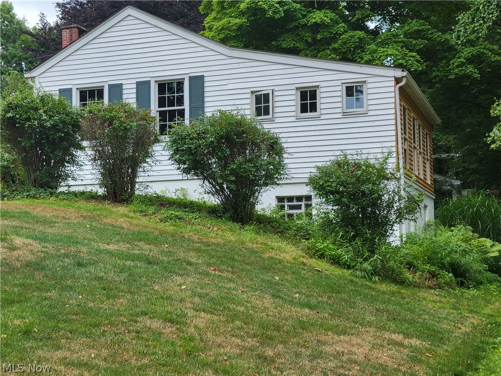 7357 Westview Road Kent, OH 44240 - Photo 6 of 30 View of property exterior featuring a lawn