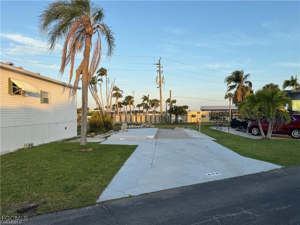 19681 Summerlin Road, Unit 493 Fort Myers, FL 33908 - Photo 1 of 8 a view of a yard with palm trees