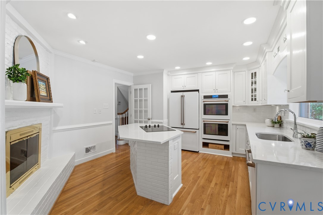 6405 Buckhill Road Richmond, VA 23225 - Photo 12 of 71 Modern kitchen featuring white cabinetry, light-to