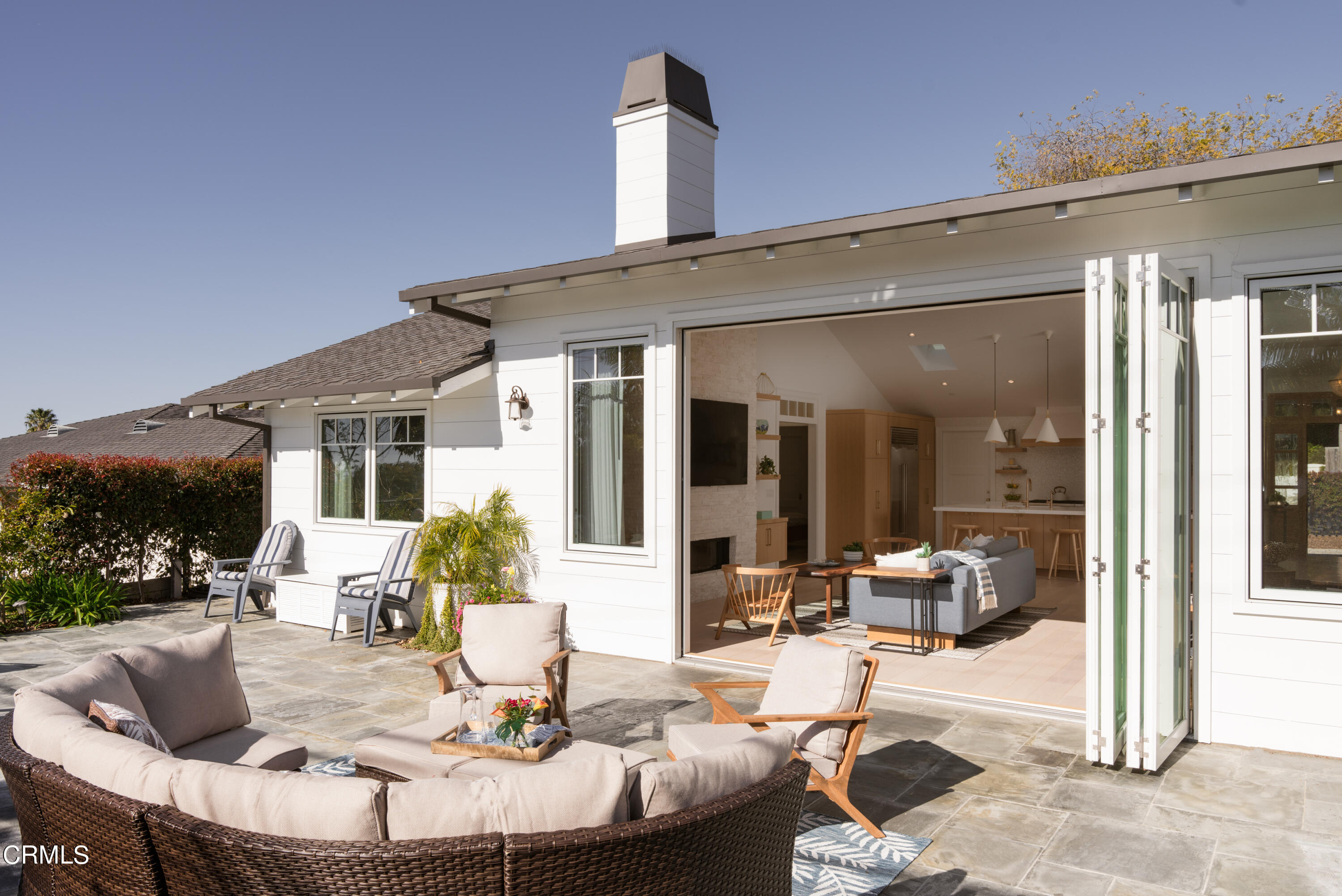 330 Salida Del Sol Santa Barbara, CA 93109 - Photo 2 of 39 a view of a patio with couches table and chairs and potted plants