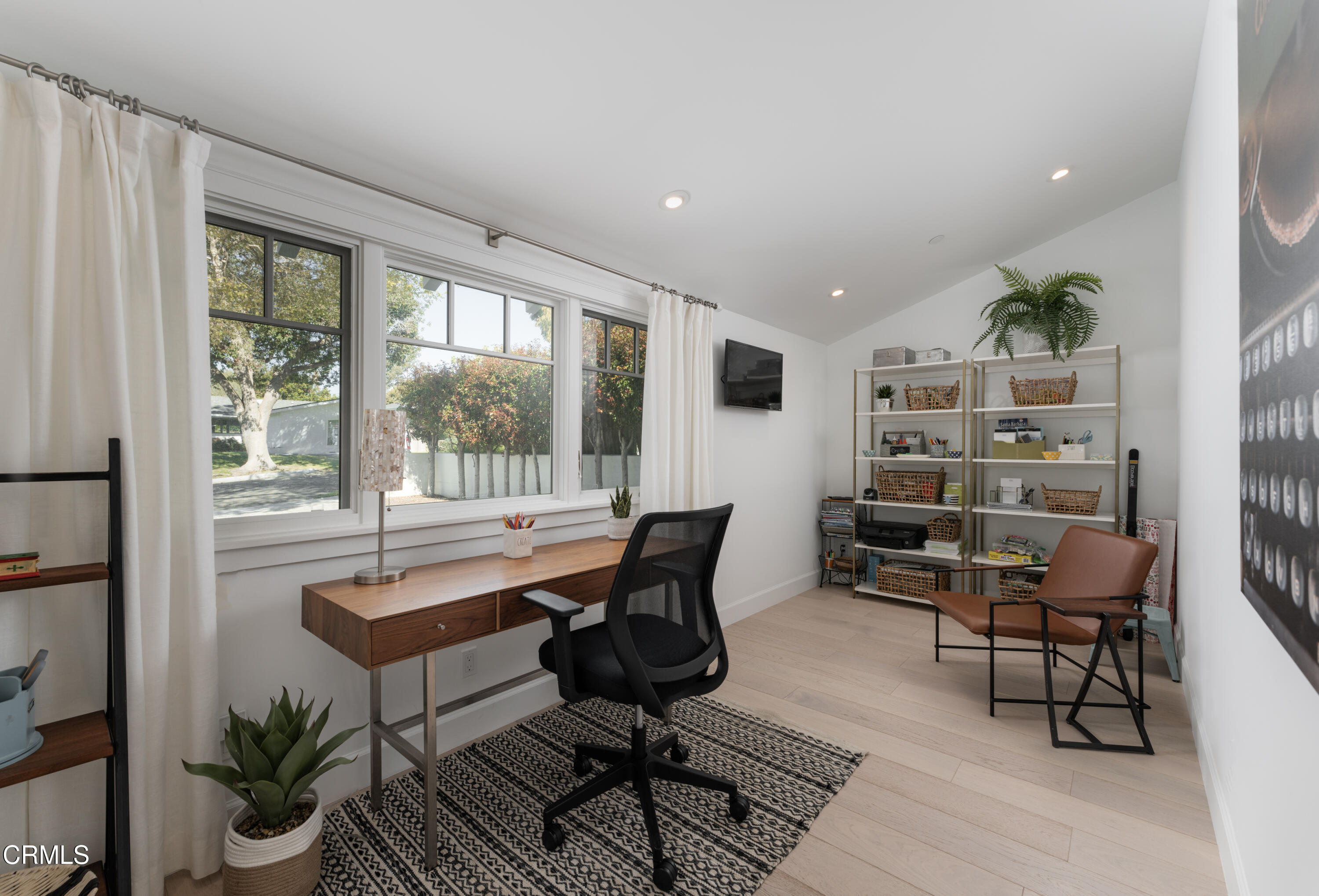 330 Salida Del Sol Santa Barbara, CA 93109 - Photo 28 of 39 a view of a workspace with furniture and a potted plant